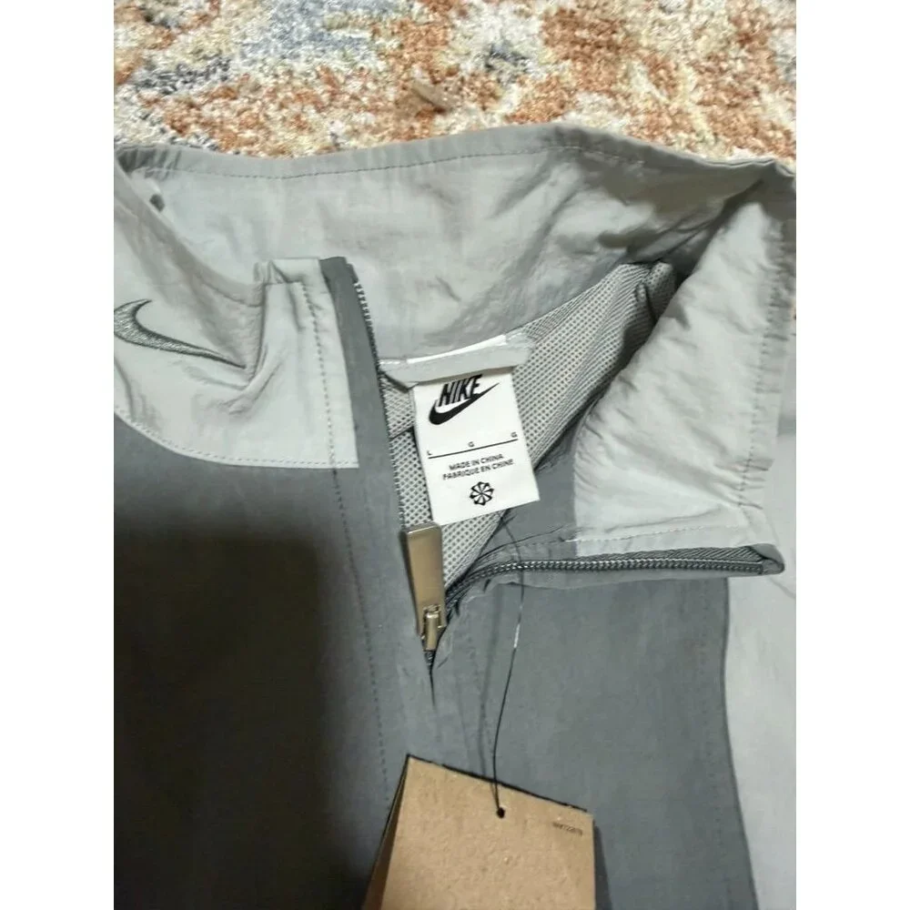 NIKE Windbreaker‎ Jacket Womens Large Gray Reflective Oversized Full Zip NEW